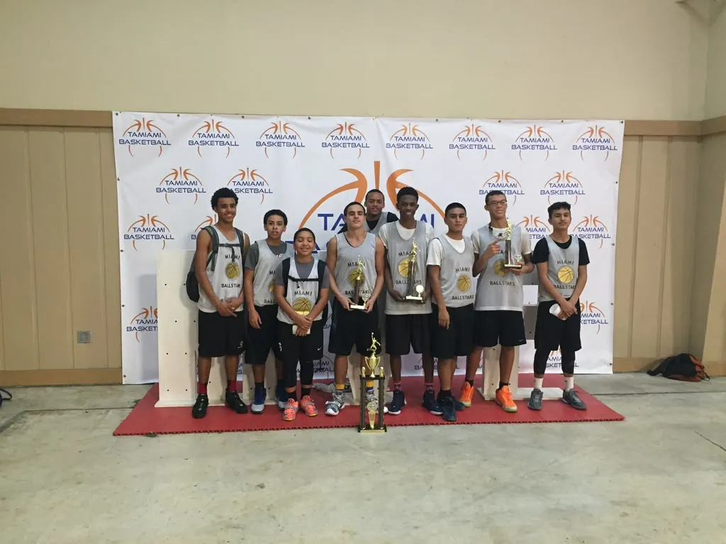 The first Miami Ballstars team, in grey jerseys, with their Tamiami league trophies in December 2015